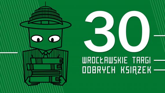 szyld Wrocławskich Targów Książki na zielonym tle, obok maskotka Targów - Hala Stulecia trzymająca książkę